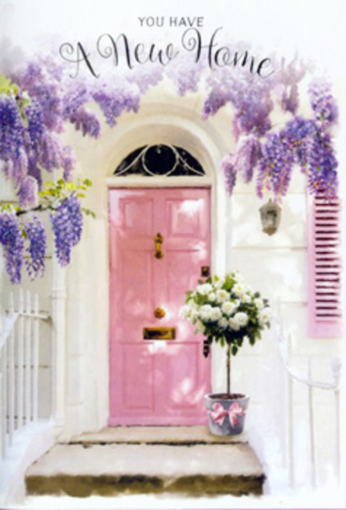 A serene entranceway in the Manor House area is bathed in gentle daylight, capturing the emotional stir of starting life in a new home. The focal point is a painted pink door, its surface smooth and subtly reflective, framed by whitewashed walls that amplify every soft ray of light. Overhead, wisteria pours down in romantic cascades of lavender and lilac, the blooms forming draping clusters that almost brush the top of the door. Their delicate petals create a feathery fringe against the façade, hinting at a sweet, slightly powdery fragrance that seems to drift towards nearby streets leading to Finsbury Park. At the doorstep sits a thoughtfully arranged bouquet presented in a simple yet stylish tin bucket, the metal a muted grey that anchors the pastel surroundings. The bucket overflows with creamy white roses, their full, rounded blooms opening generously, each flower edged with subtle shadows that give them depth and softness. Interwoven are stems of fresh greenery, adding hints of sage and soft eucalyptus tones that make the arrangement feel lush and alive. A satin-like pink ribbon is tied at the base, its trailing ends echoing the curves of the wisteria above, creating a cohesive flow from top to bottom. The composition feels like a quiet blessing for whoever is about to cross this threshold: a whisper of good fortune, shared laughter, and cosy evenings at home. It could easily be a housewarming delivery for a couple settling into Manor House, a floral embrace that turns a new address into a place of belonging, beauty, and heartfelt welcome.